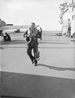 Lieut (A) D M Jeram, RN, Grumman Martlet fighter pilot 888 Squadron, who shot down two French aircraft in the initial North African Offensive, walking to his aircraft.