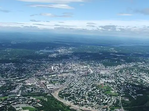 Worcester and the surrounding areas in 2006, looking north from 3,700 feet (1,100 m). Route 146 can be seen under construction.