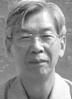 Black and white headshot of Yasuyuki Tanaka.