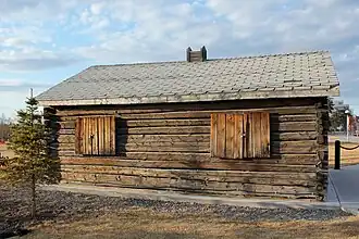 Side similar to the one seen two images above, at a slight angle, with another small tree at the right