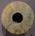A Western Han dynasty green jade Bi disk, with dragon designs