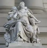 One of four sculptures by Daniel Chester French, installed outside the Alexander Hamilton U.S. Custom House